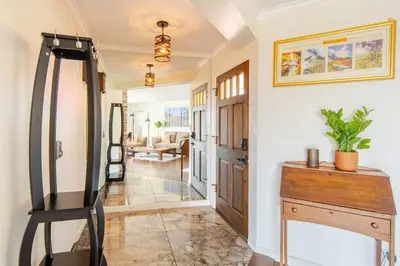 a hallway with a room with a mirror and a dresser at Luxury View Home Perfect for SD Getaway Sleeps 12 in La Mesa