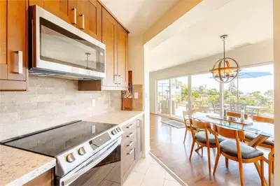 a kitchen with a table and a dining room at Luxury View Home Perfect for SD Getaway Sleeps 12 in La Mesa