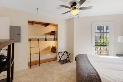 a bedroom with two bunk beds and a ceiling fan at Luxury View Home Perfect for SD Getaway Sleeps 12 in La Mesa