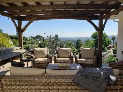 a patio with a couch and chairs and a table at Luxury View Home Perfect for SD Getaway Sleeps 12 in La Mesa