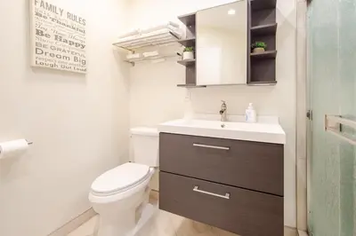 a small bathroom with a toilet and a sink at Luxury View Home Perfect for SD Getaway Sleeps 12 in La Mesa