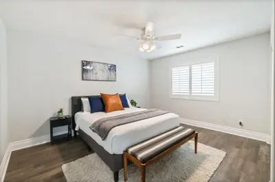 a bedroom with a bed and a ceiling fan at King Bed Temecula Getaway Amazing Pool and Theatre in Murrieta
