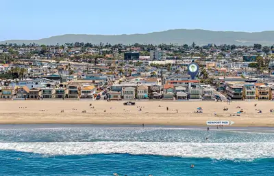 a view of a beach with people and buildings at Pet-Friendly 3Br W Ac, Rooftop Deck, 2 Houses From Beach By Beachview Rentals in Newport Beach