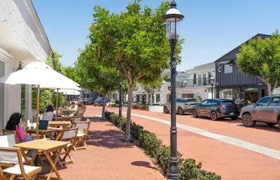 a street with tables and chairs and a street light at Pet-Friendly 3Br W Ac, Rooftop Deck, 2 Houses From Beach By Beachview Rentals in Newport Beach