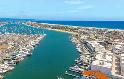 an aerial view of a harbor with boats in the water at Family-Friendly 3Br Steps From Beach - Walk To Everything By Beachview Rentals in Newport Beach