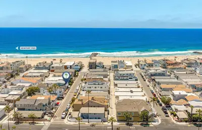 an aerial view of a city with the beach at Updated 2Br Getaway Half Block From Popular 44Th St Beach By Beachview Rentals in Newport Beach