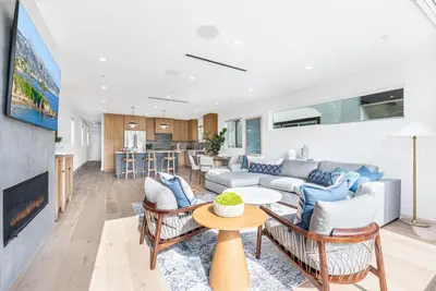 a living room with a couch and chairs at Luxury 3Br W Rooftop Deck, Grill, Ac, Steps From The Sand By Beachview Rentals in Newport Beach