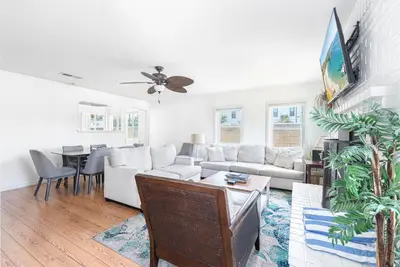 a living room with a couch and a table at Charming 3Br Beach Home W Rooftop Deck One Block From Sand By Beachview Rentals in Newport Beach