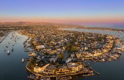 an aerial view of a harbor with boats in the water at Iconic 4Br Bayfront Home W Unmatched Indooroutdoor Living By Beachview Rentals in Newport Beach