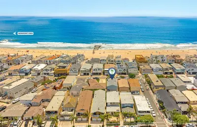 an aerial view of a city and the beach at Spacious 6Br W Oceanview And Garden Patio, Steps To Sand By Beachview Rentals in Newport Beach