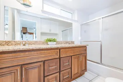 a bathroom with a sink and a shower at Spacious 4Br W Oceanview Balcony And Bbq, Steps To Sand By Beachview Rentals in Newport Beach