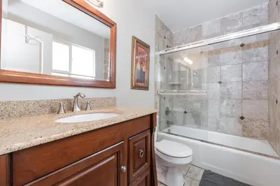 a bathroom with a sink and a shower and a toilet at 3Br Oceanfront At Balboa Pier, Ac, Walk To It All By Beachview Rentals in Newport Beach