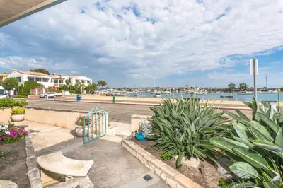 a view of the marina from the balcony of a apartment at Spacious 3Br Bayfront W Harbor Views, Walk To Beach By Beachview Rentals in Newport Beach