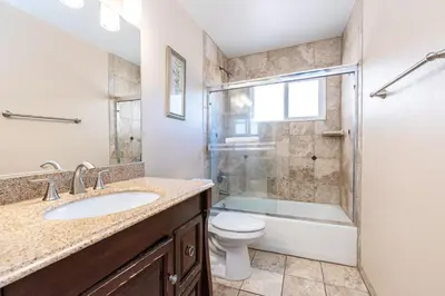 a bathroom with a sink and a toilet and a shower at 3Br Oceanfront At Balboa Pier W Ac And Great Walkability By Beachview Rentals in Newport Beach