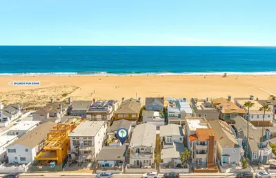 an aerial view of a beach with houses and the ocean at Luxury 6Br Triplex In Prime Location One House From Sand By Beachview Rentals in Newport Beach