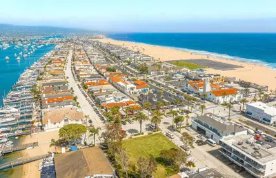 an aerial view of a beach and the ocean at Updated 2Br Cottage One House From Beach - Super Central By Beachview Rentals in Newport Beach