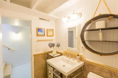 a bathroom with a sink and a mirror at The Lantern House, Walk to Harbor, Great Outdoors in Dana Point