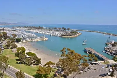 a marina with a bunch of boats in the water at The Lantern House, Walk to Harbor, Great Outdoors in Dana Point