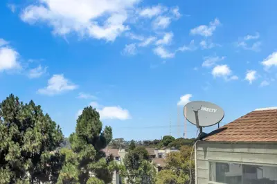 a satellite dish on the roof of a building at Point Loma 2BR Townhome w Parking in Prime Location in San Diego