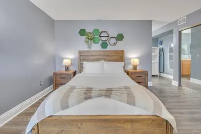a bedroom with a large bed and two night stands at Point Loma 2BR Townhome w Parking in Prime Location in San Diego