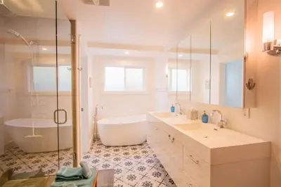 a bathroom with two sinks and a tub and a shower at Deluxe Master Studio Private Entrance and Patio in San Diego
