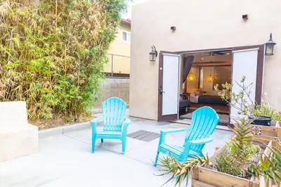 two blue chairs sitting on a patio at Deluxe Master Studio Private Entrance and Patio in San Diego