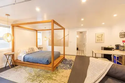 a bedroom with a canopy bed in a room at Deluxe Master Studio Private Entrance and Patio in San Diego