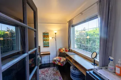 a room with a window and a wooden bench at Studio w Private Entrance Convenient and Cozy in San Diego