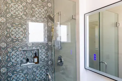 a bathroom with a shower with a glass door at Studio w Private Entrance Convenient and Cozy in San Diego