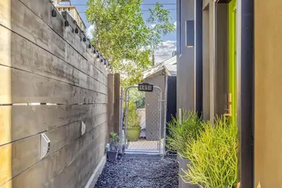 an alley leading to a house with a gate at North Park 1BR Cottage Prime Location with Parking in San Diego