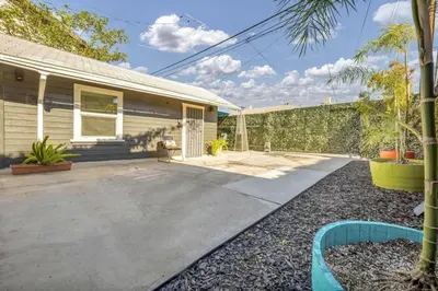 a home with a driveway and a house at North Park 1BR Cottage Prime Location with Parking in San Diego