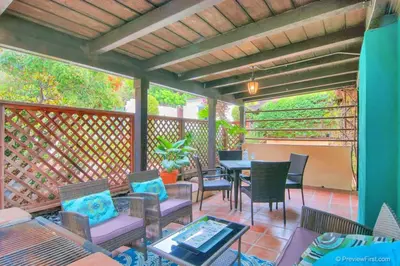 a patio with a table and chairs on a deck at Old Town 1BR Short Drive to Downtown and Beaches 4.5 in San Diego