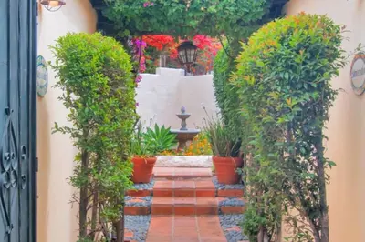 a garden with a pathway with plants and a fountain at Old Town 1BR Short Drive to Downtown and Beaches 4.5 in San Diego