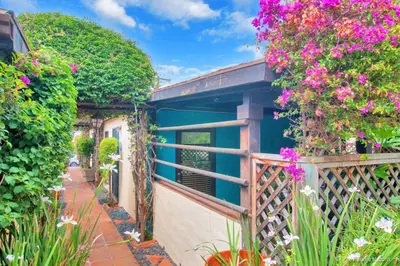 a balcony with flowers and a fence at Old Town 1BR Short Drive to Downtown and Beaches 4.5 in San Diego