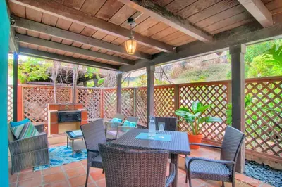 a patio with a table and chairs on a deck at Old Town 1BR Short Drive to Downtown and Beaches 4.5 in San Diego