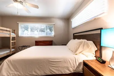a bedroom with a large white bed and a window at Staycation Beach Family Home Great Indoor Outdoor in Carlsbad