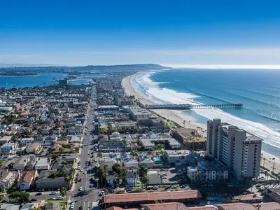 an aerial view of a beach and the ocean at Pacific Beach Cottage 4 Walk to the Beach and Bay in San Diego