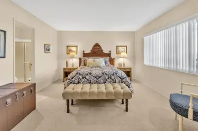 a large bedroom with a bed and a window at 2BR Condo with Views Near Shops and Food, Fast WiFi in Carlsbad