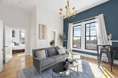 a living room with a couch and a table at Victorian Gem Close to Petco Park & Gaslamp in San Diego