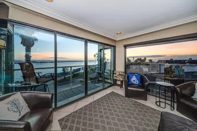 a living room with a view of the ocean at Ocean Vista Penthouse 2 in San Diego