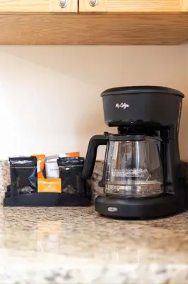 a coffee maker sitting on top of a counter at Steps to Ocean Sunset Views Beach Access & San Diego Charm in San Diego