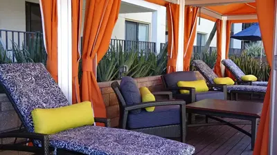 a group of chairs and tables on a patio at Ariva in San Diego