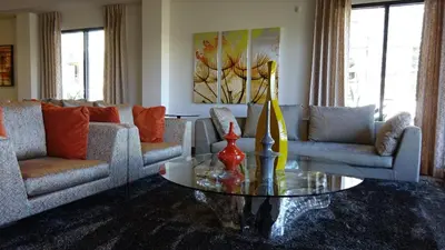 a living room with couches and a coffee table at Ariva in San Diego