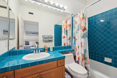 a bathroom with a toilet and a sink and a shower at Exquisite Panoramic View Estate in Newport Beach