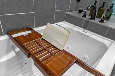 a wooden chair sitting on top of a bath tub at Spacious House close to Petco Park and Gaslamp in San Diego