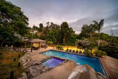 a swimming pool in a yard with a gazebo at Mountain Villa in San Diego - Pool & Waterslide, Spa, Pickle Ball, Game room in La Mesa