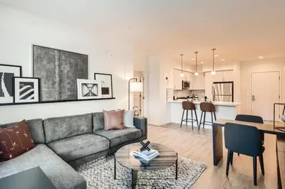 a living room with a couch and a table at Vive Luxe in San Diego