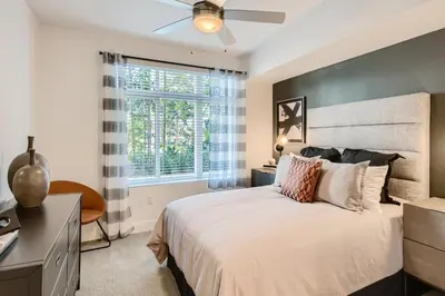 a bedroom with a large bed and a window at Vive Luxe in San Diego