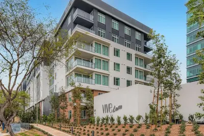an apartment building with a white facade at Vive Luxe in San Diego