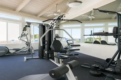 a gym with treadmills and weights in a room at #Marbella Lane - Bayfront Bliss Sunset Views & Pool in San Diego